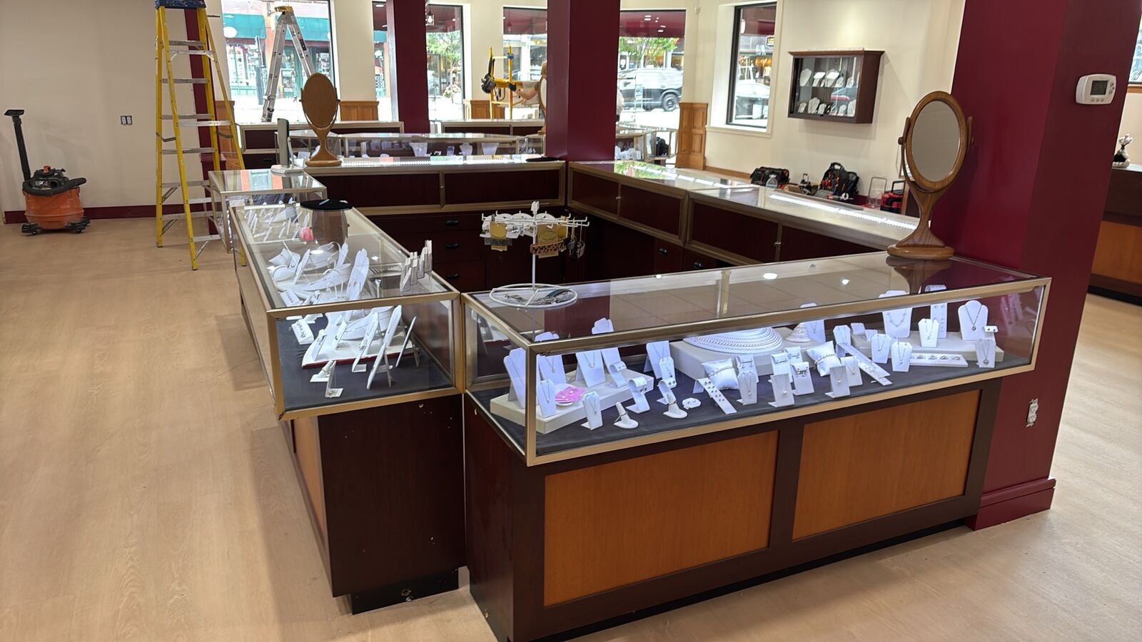 Lit glass jewelry display cases in the finished Capitol Craftsman & Romance Jewelers showroom in Concord, NH